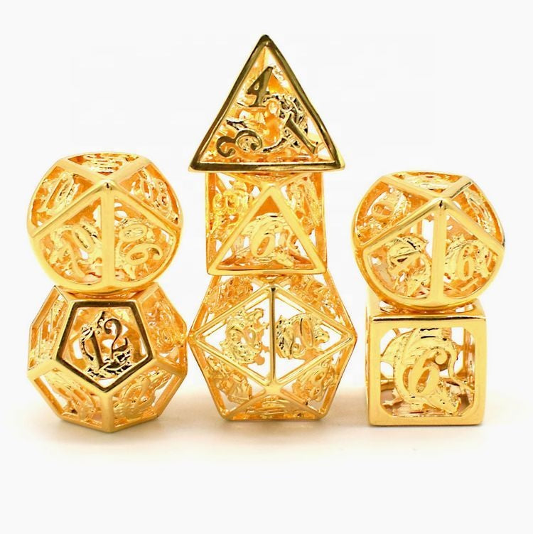 Hollow metal dice with a carved dragon